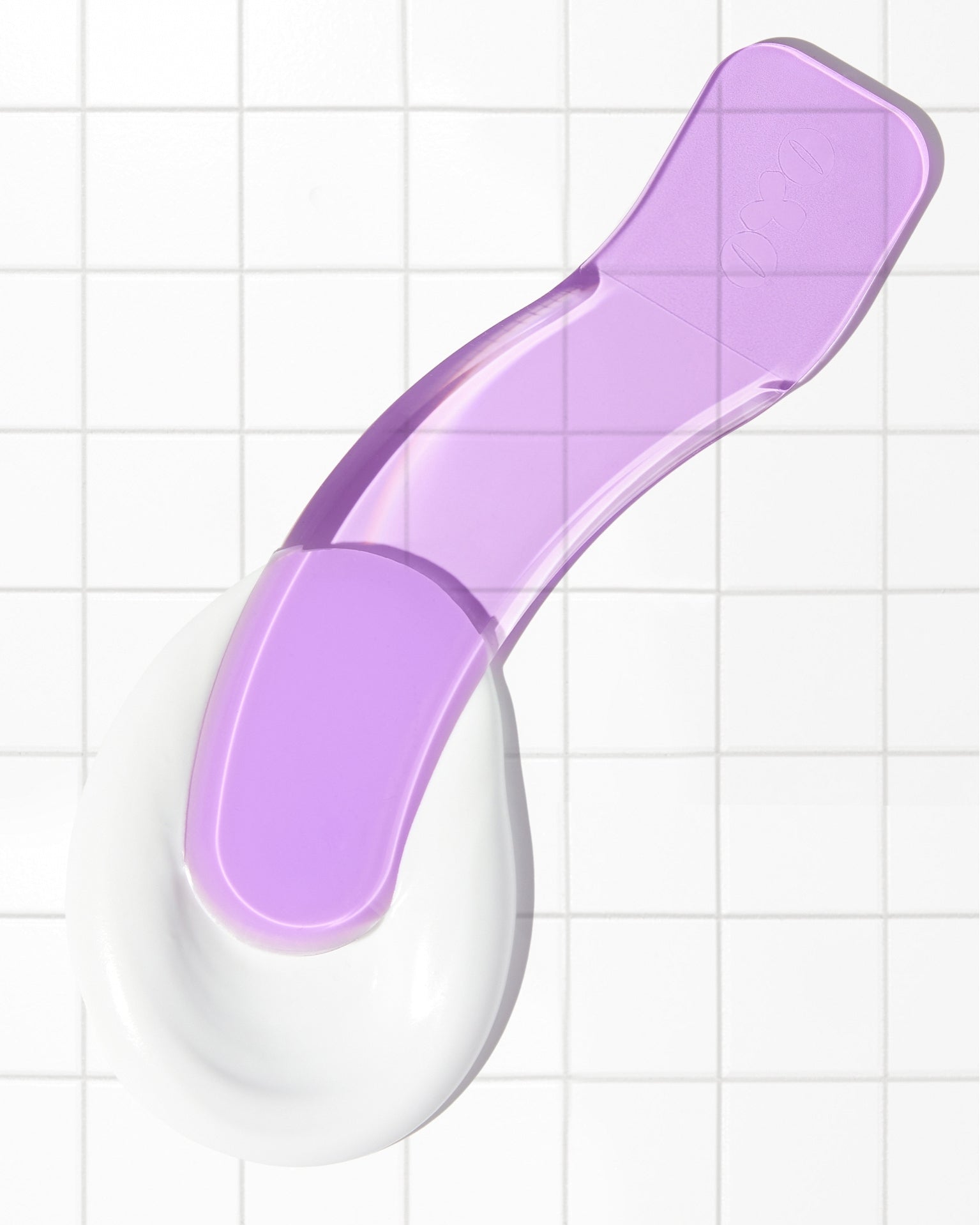 Bye Bye Bush hair removal cream applicator with smooth white base and purple handle for hassle-free skincare.