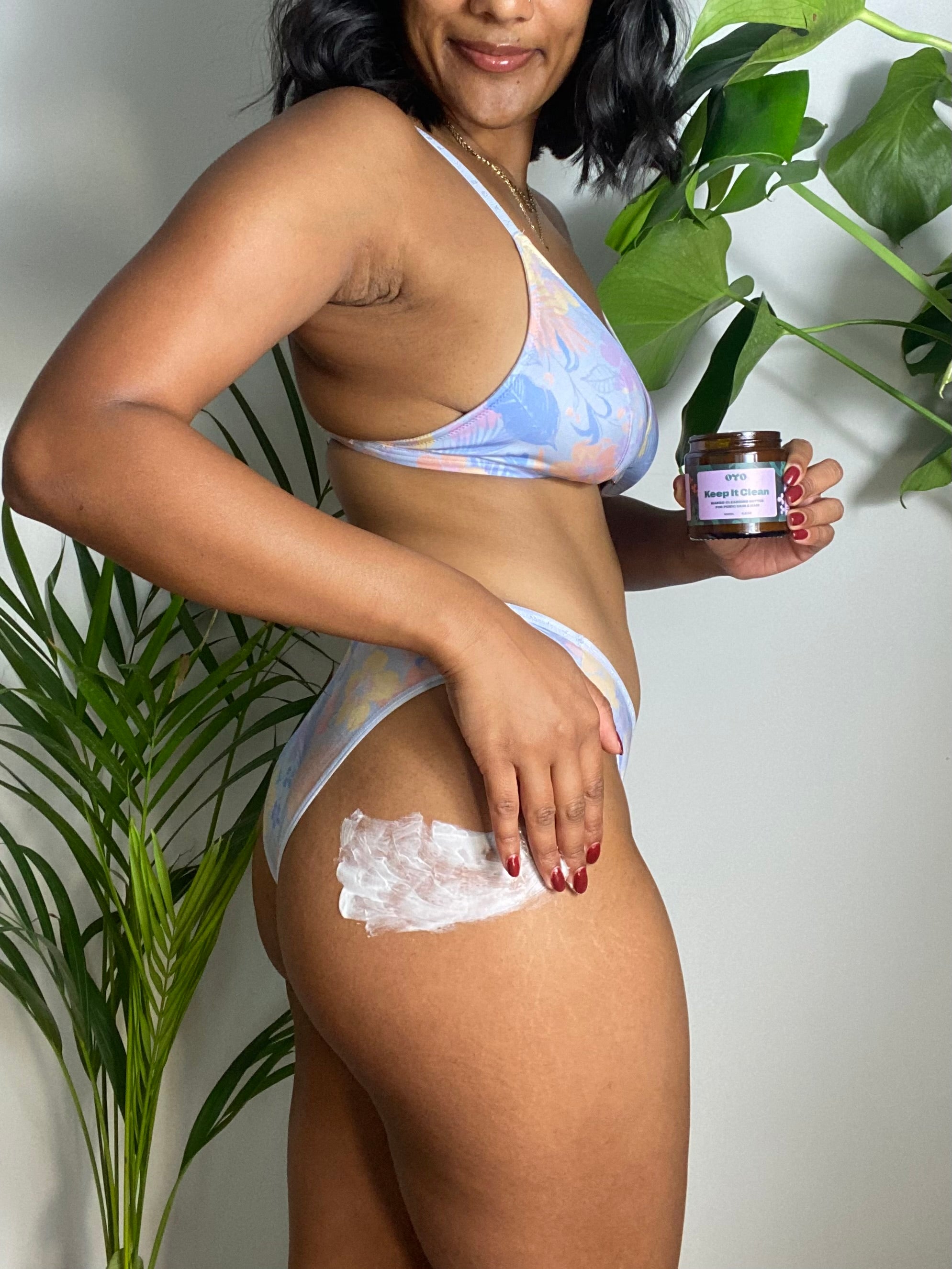 Woman applying natural skincare for intimate areas, ensuring soft skin with clean ingredients and no irritation.
