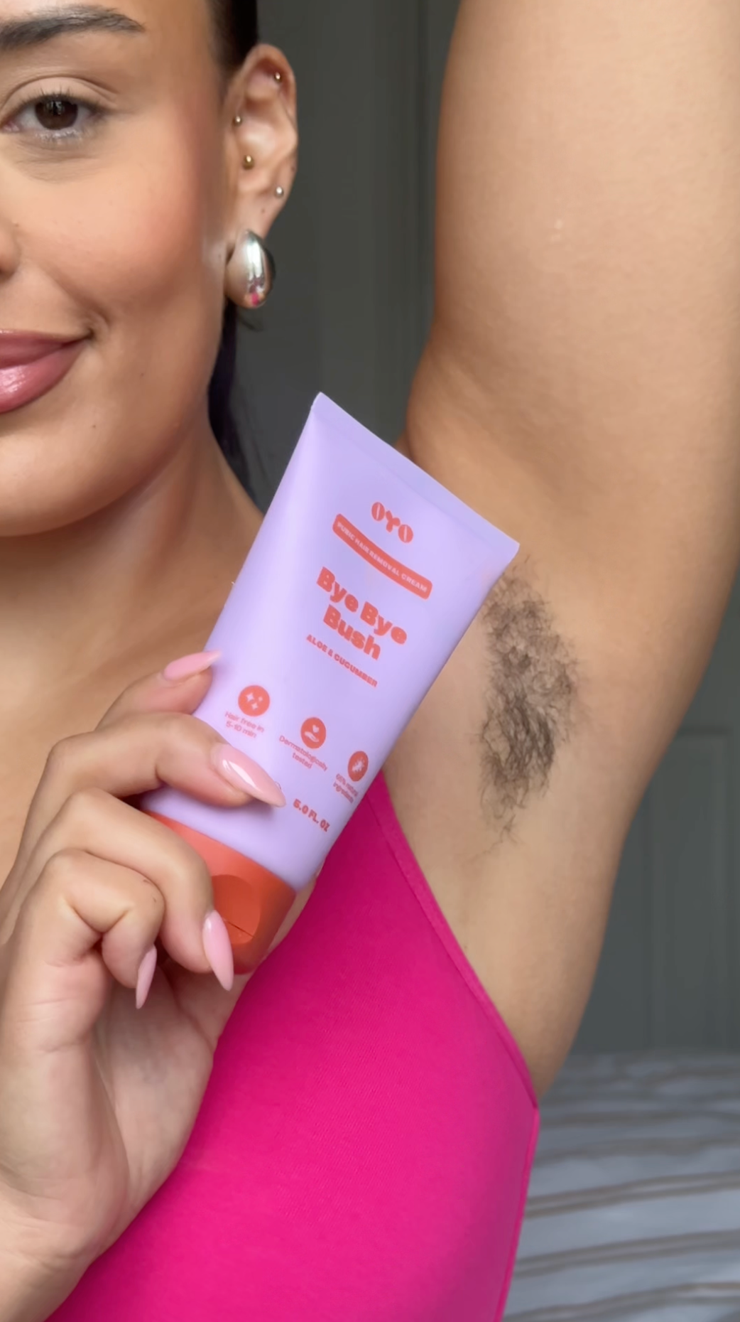 Model showcasing natural skincare product to reduce bumps and ingrowns, promoting soft, nourished skin for all types.