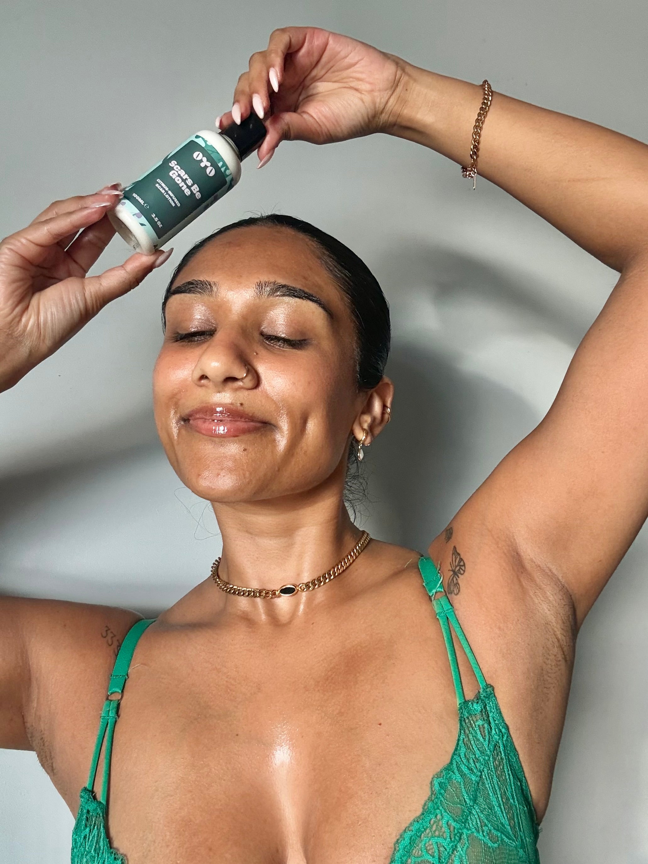 Woman showcasing natural skincare for intimate areas, promoting smooth, nourished skin and reducing bumps & ingrowns.